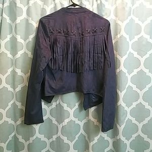 Blue suede jacket with fringes.